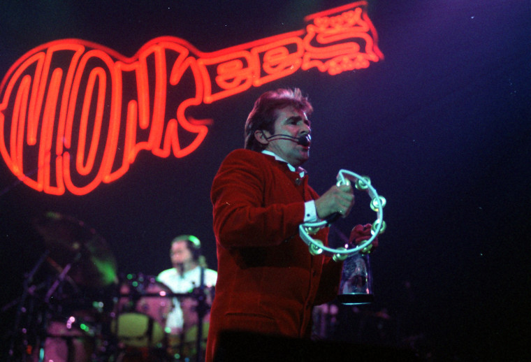 Pop Music - American 60s pop group The Monkees pictured playing the Cardiff International Arena - Davy Jones plays a tambourine during the concert - 12th March 1997. Mirrorpix/Courtesy Everett Collection (MPCF_008292)