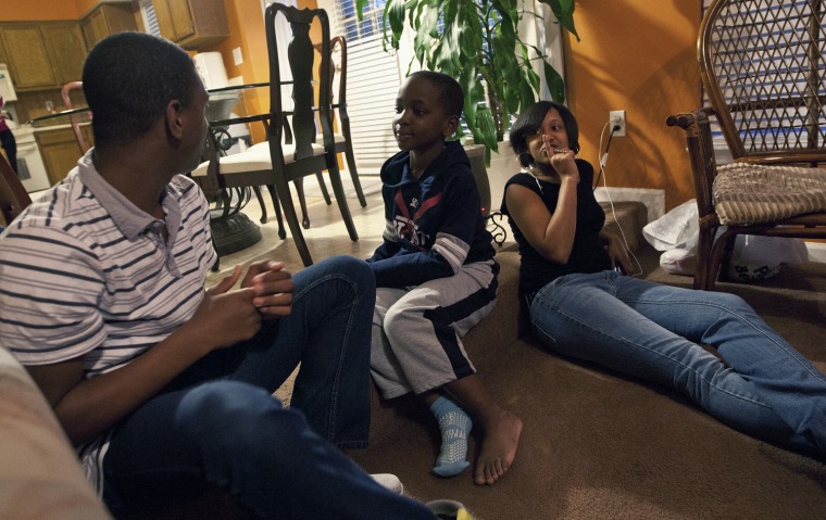 Image: Jamal Stevens, 7, is seen with his cousins Devon Bennett, 13, and Miriah Bennett, 15, at his grandparent's home in Charlotte