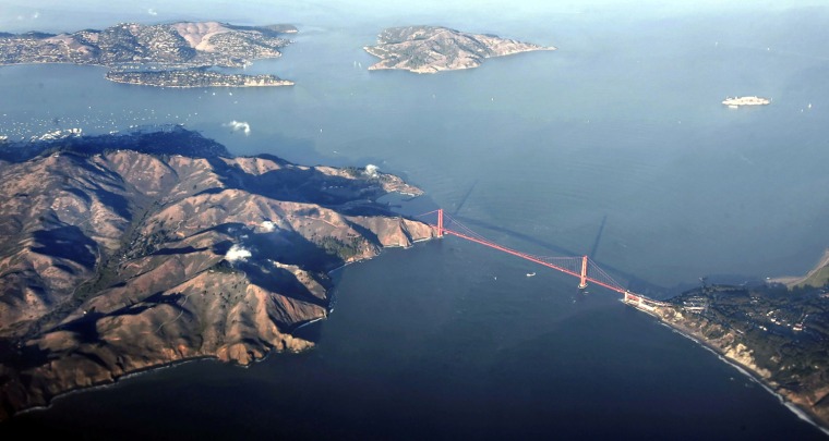 Image: -PHOTO TAKEN 04NOV05- San Francisco's Golden Gate Bridge is seen in this aerial photo at sunset Nove..