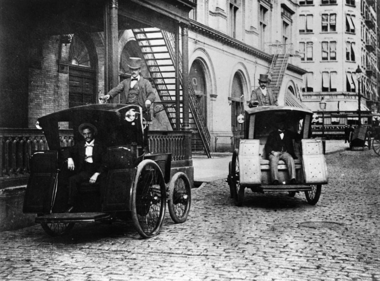 Morris and Salom Electrobats are seen in front of the Old Metropolitan Opera House on 39th Street in the Manhattan borough of New York, 1898. The electrobats are electric battery-powered cars that served as early taxis in the city. (AP Photo/Museum of Modern Art)