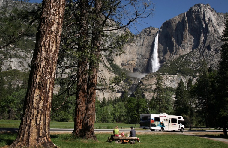 Image: Family has picnic in view of Yosemite Falls in Yosemite National Park