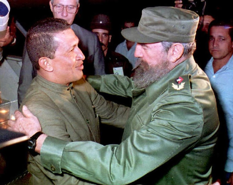 Image: Cuban President Fidel Castro(R) greets retired Ven