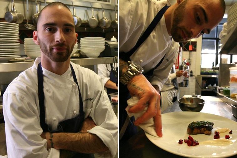 Doug Rodrigues, chef de cuisine at Clio restaurant in Boston, prepares a foie gras dish