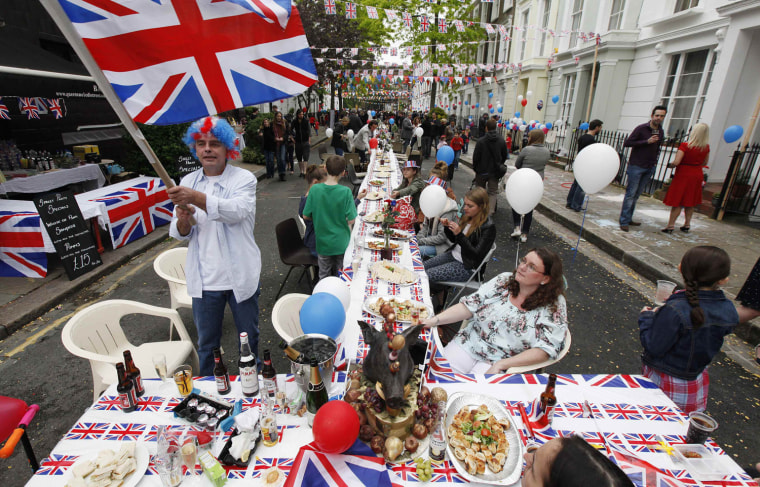 Image: Revelers attend a street party in London's Primrose Hill to celebrate Britain's Queen Elizabeth's diamond jubilee weekend
