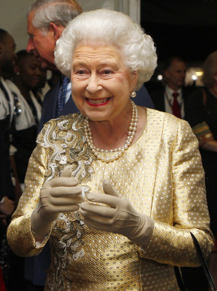 Image: Queen Elizabeth II greets performers bac
