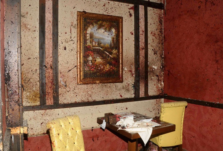 Image: Blood covers the walls and furniture of a restaurant after a suicide bombing, at al-Basel Sport city in Aleppo