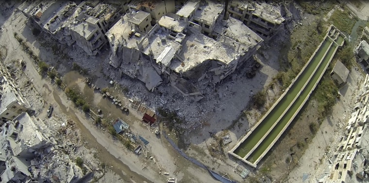 Image: An undated picture taken from an unmanned remote-controlled miniature aircraft with an attached camera, which rebels say belonged to forces loyal to Syria's President Bashar al-Assad, shows an aerial view of the destruction in part of Homs