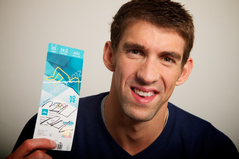 2012 Neil Leifer -- USA swimmer Michael Phelps for a portrait by Neil Leifer during the 2012 Olympics in London, UK on August 7, 2012. Phelps is holding a signed ticket from the night he won his last individual gold medal (his 17th). He finished the games and retired with 22 medals overall.