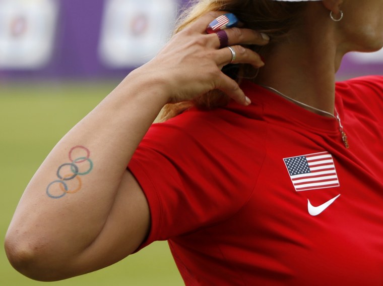 Image: An Olympic rings tattoo of Khatuna Lorig of the U.S. is seen during the women's archery individual ranking round of the London 2012 Olympics Games at the Lords Cricket Ground in London