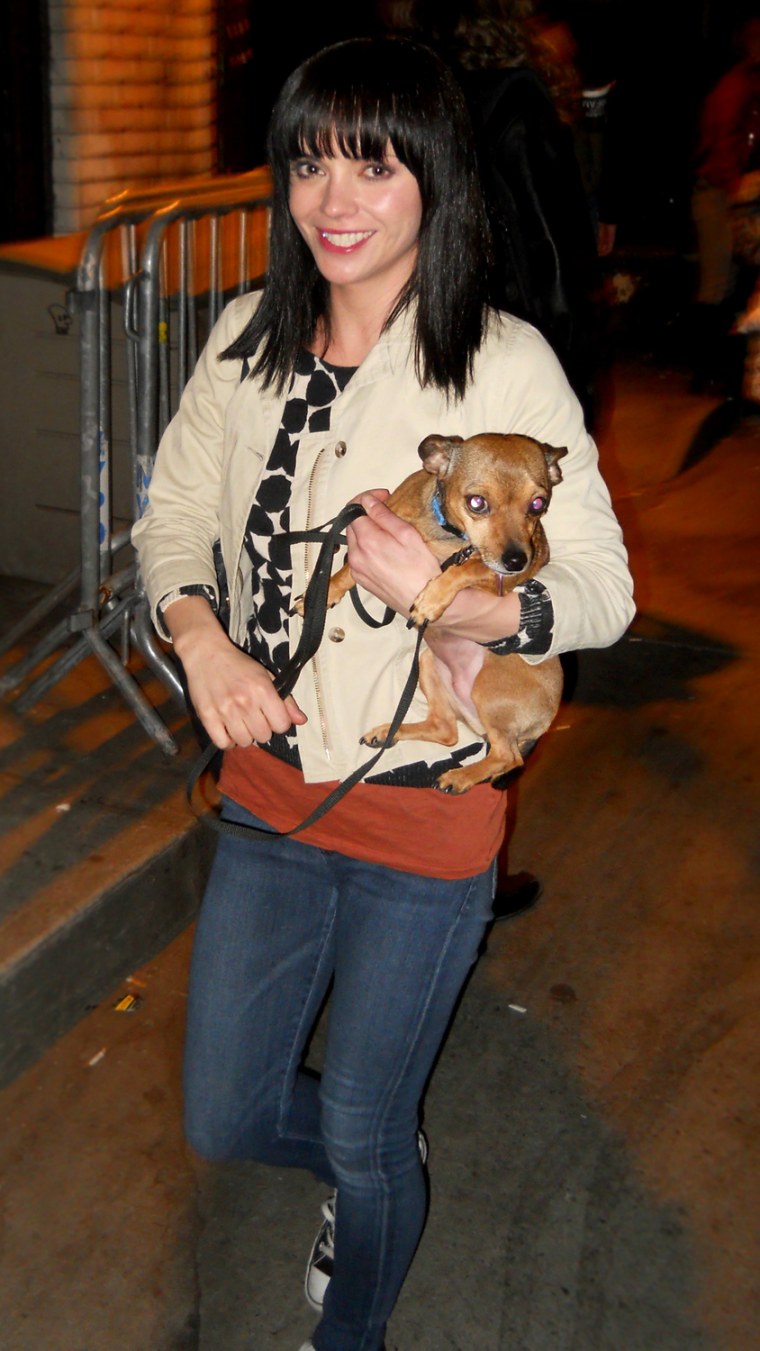 Christina Ricci w/ her little dog signing autographs and tending to fans outside the Classic Stage Company after finishing a daily preview performance of \"A Midsummer Night's Dream', NYC