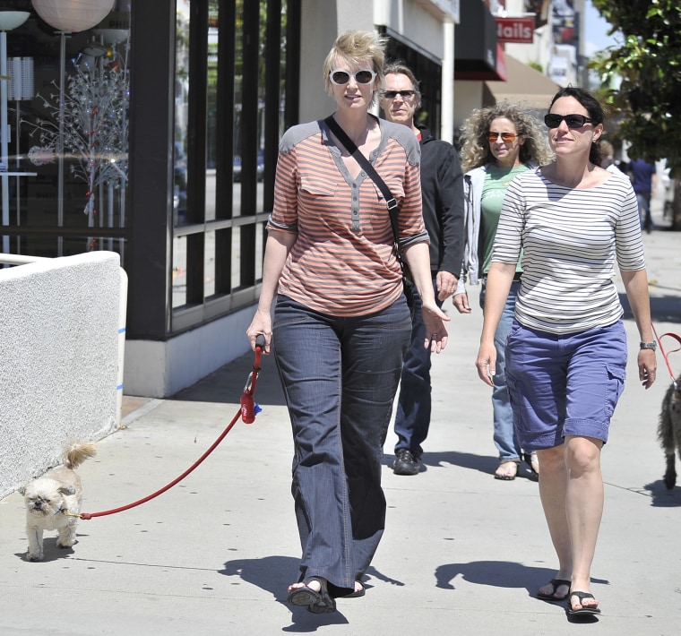 Jane Lynch and her wife, Lara Embry, and dog go for a walk in West Hollywood, Ca