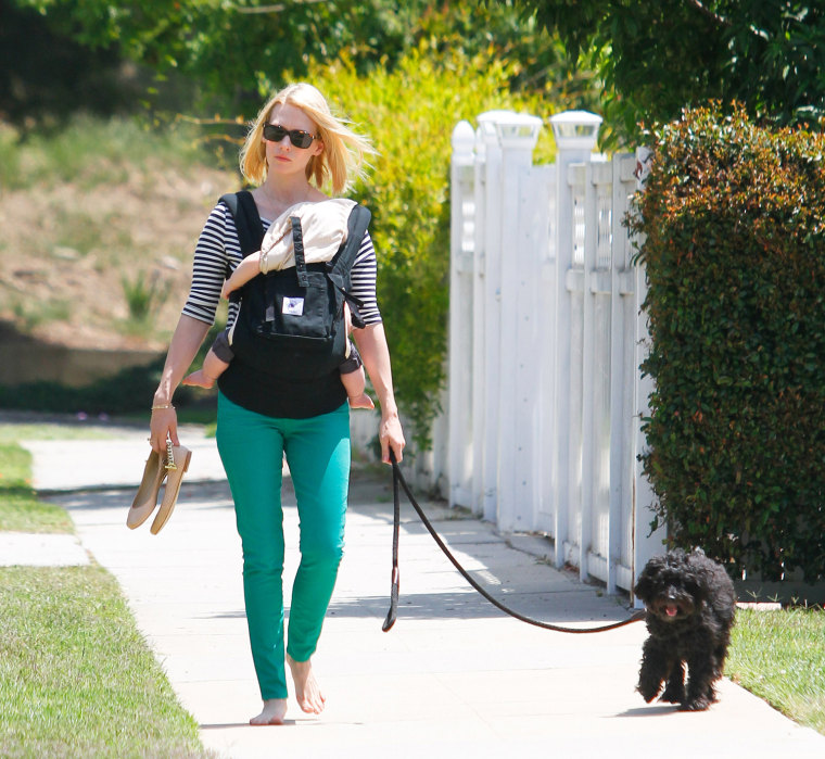 January Jones takes off her shoes and goes barefoot to walk her dog with baby baby Xander in Los Feliz, CA.