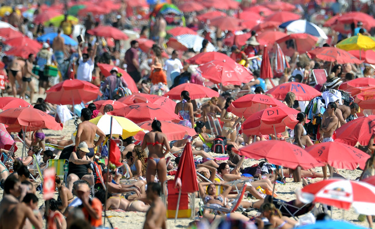 Image: Locals and tourists enjoy Ipanema beach