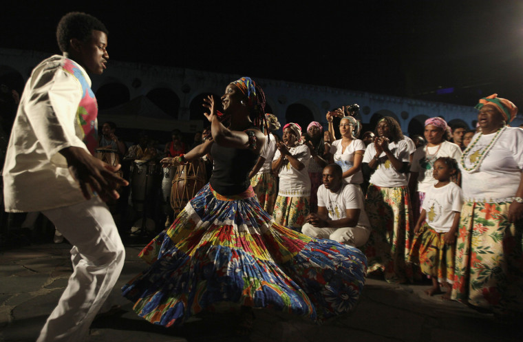 Image: People dance the Jongo an Afro-Brazilian dance where samba derives some of its roots from in Rio de Janeiro