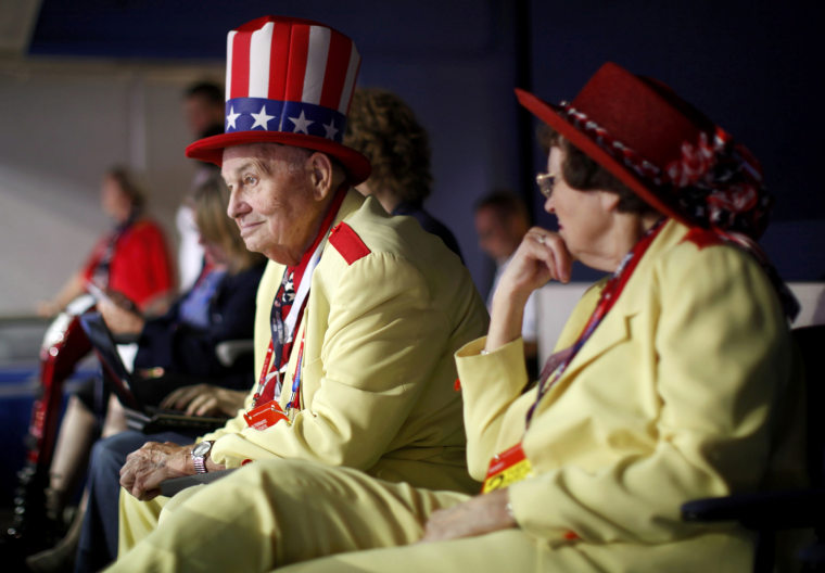 Image: Convention goer Oscar Poole from Georgia listens during the second session of the 2012 Republican National Convention in Tampa