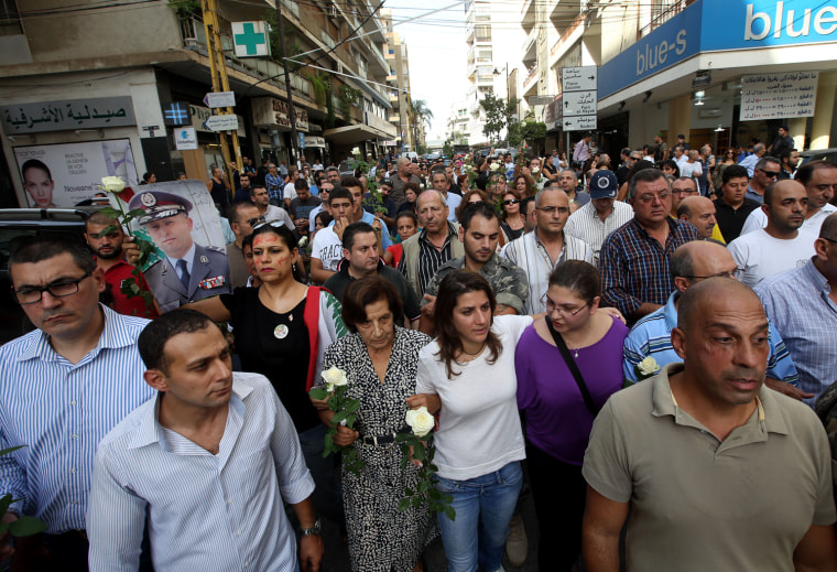 Image: Protesters march in the Achrafieh neighborhood