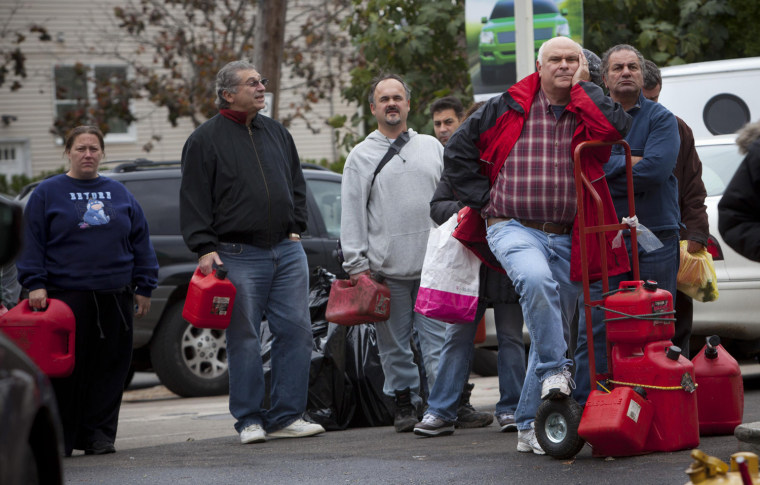 Image: People line up for fuel in the corner of Hylan Boulevard and Reid Avenue in Staten Island