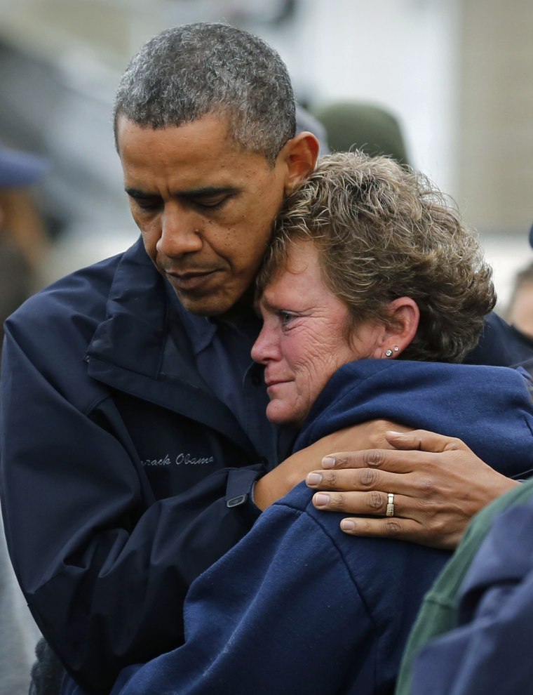 Image: U.S. President Obama hugs marina owner after it was destroyed by Hurricane Sandy in New Jersey