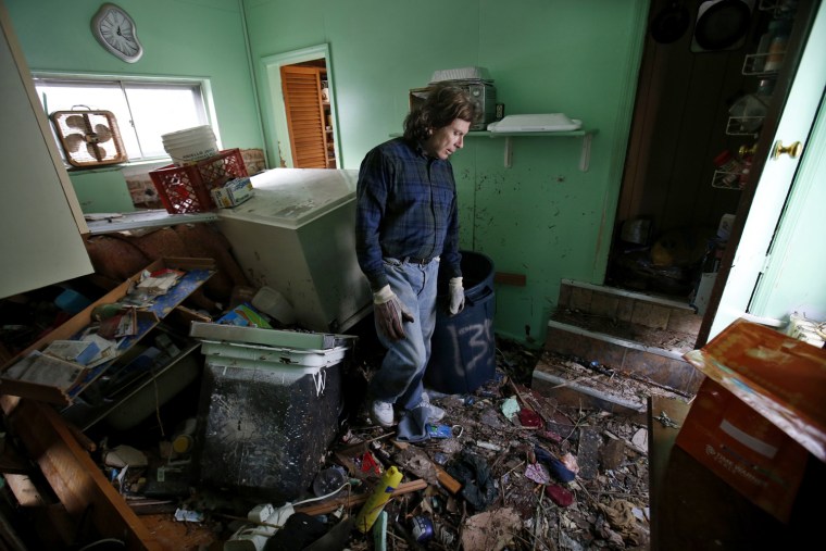 Image: Steve Santo stands in what used to be the kitchen of his house that was destroyed by storm surge flooding on the south side of hard-hit Staten Island