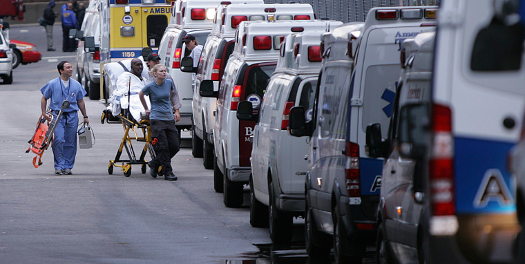Image: A patient is wheeled out of Bellevue Hospital during an evacuation in the aftermath of Hurricane Sandy in New York