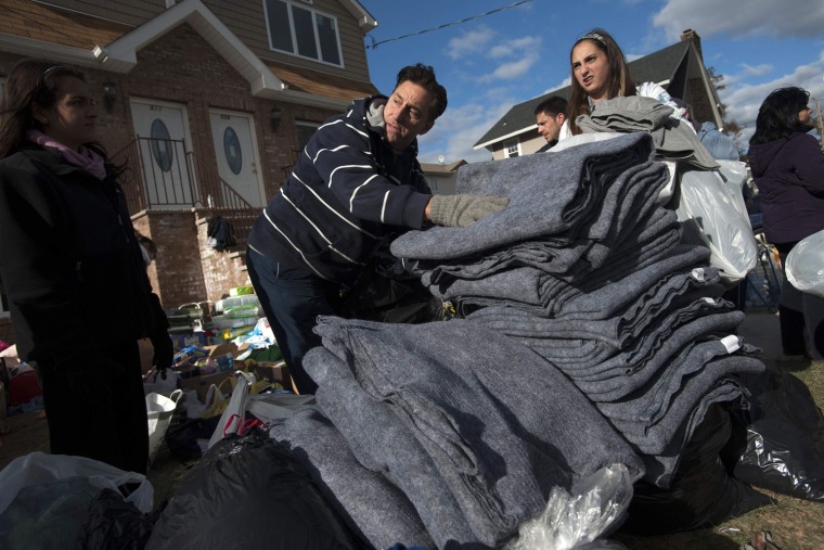 Image: Volunteers deliver blankets to residents affected by Hurricane Sandy in the Staten Island Borough of New York