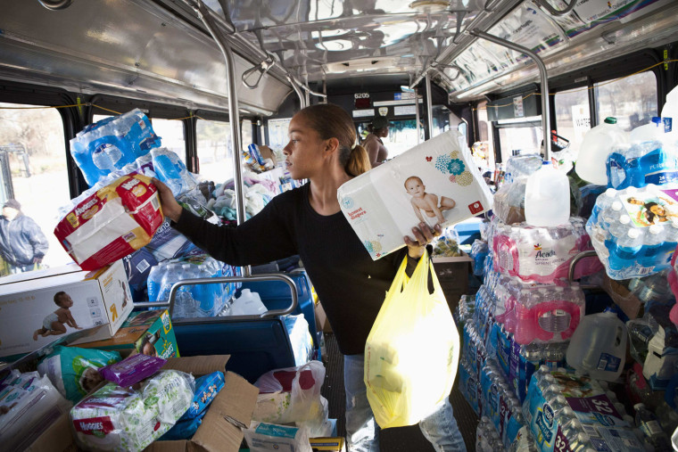 Image: Wakefield organizes donated goods that is being housed in an Metropolitan Transit Authority bus in the Midland Beach neighbourhood of Staten Island