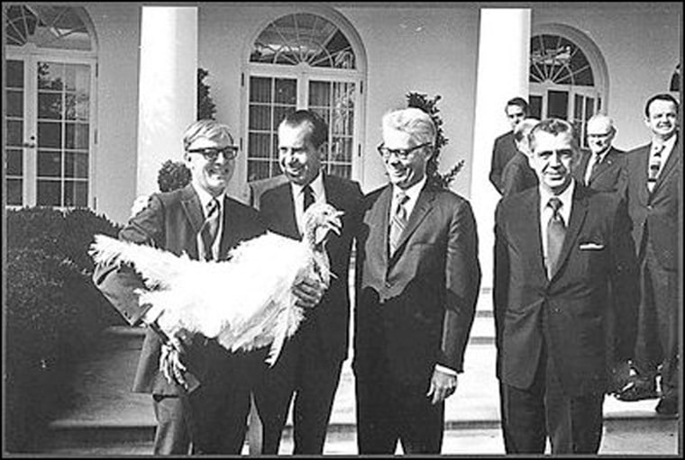 Undated President Richard Nixon receiving a Thanksgiving turkey from members during the annual pardoning ceremony.