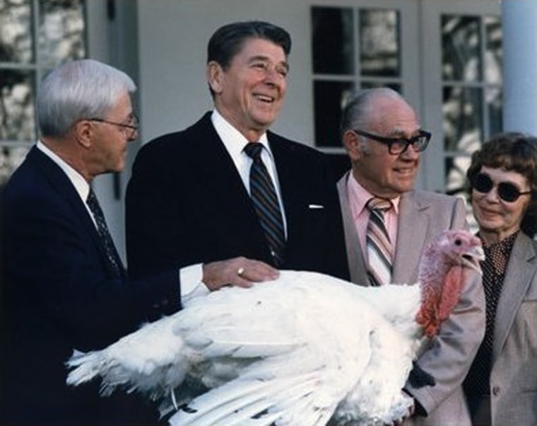 President Ronald Reagan pardons a turkey in the annual White House ceremony. 1983