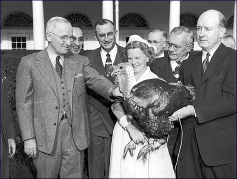 President Truman offers a turkey, presented to him by the National Egg and Poultry Board, a reprieve in the White House Rose Garden. November 16, 1949.

Harry S. Truman Presidential Library
