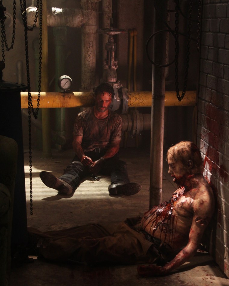 Rick Grimes (Andrew Lincoln) and Walker - The Walking Dead - Season 3, Episode 5 - Photo Credit: Greg Nicotero/AMC