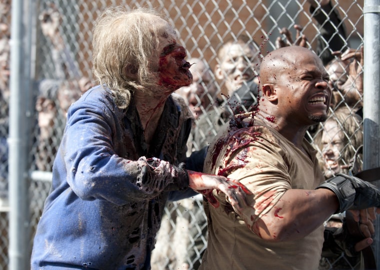 Walkers and T-Dog (Robert 'IronE' Singleton) - The Walking Dead - Season 3, Episode 4 - Photo Credit: Gene Page/AMC