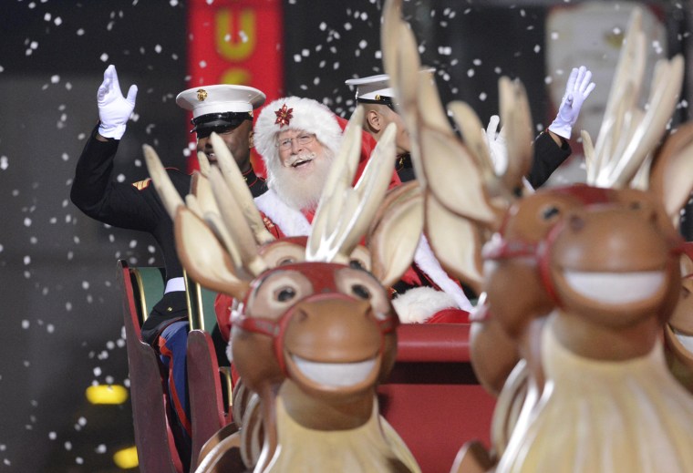 Image: A man dressed as Santa Claus attends the 2012 Hollywood Christmas Parade in Los Angeles