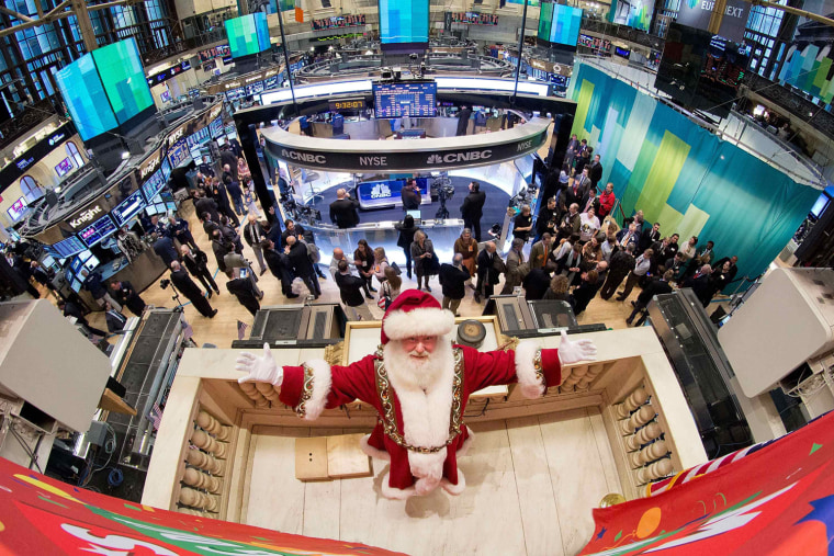 Image: Handout photo of Santa Claus posing after ringing the opening bell at the New York Stock Exchange