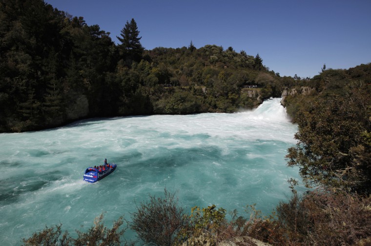 Visitors on a jet boat take in the sights of Taupo's Huka Falls on the Waikato river