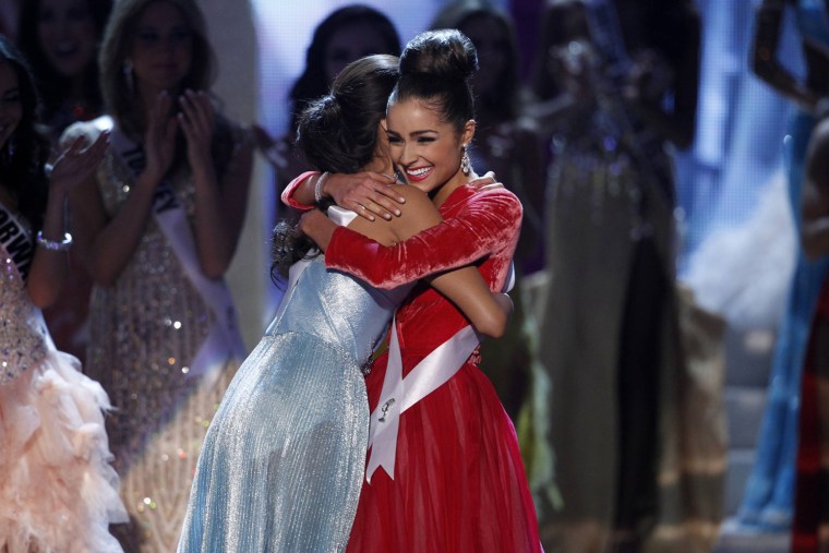Image: Miss USA Culpo is congratulated by Miss Philippines Tugonon after winning Miss Universe pageant in Las Vegas