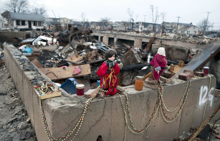 Image: Christmas ornaments amongst the remains of homes destroyed by fire during Hurricane Sandy in the Breezy Point area of New York's borough of Queens
