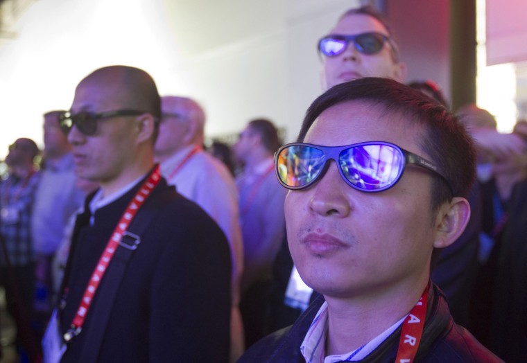 Image: Attendees wear 3D glasses as they watch a presentation in the LG Electronics booth during the first day of the Consumer Electronics Show in Las Vegas
