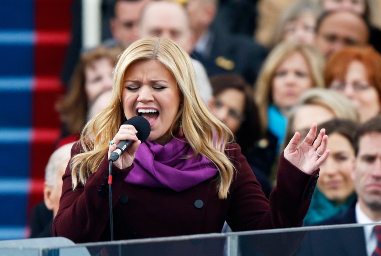 Image: Kelly Clarkson sings \"My Country 'Tis of Thee\" during swearing-in ceremonies for U.S. President Barack Obama on the West front of the U.S Capitol in Washington