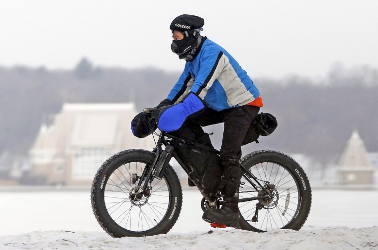 Image: Biker practices for race during cold weather in Minneapolis