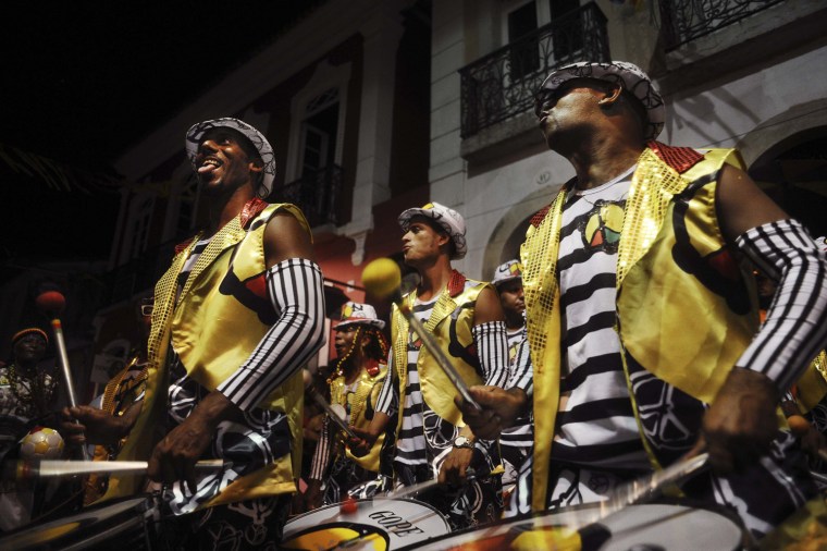 Image: Members of Afro-Brazilian cultural group Olodum perform during a Carnival street party in Salvador da Bahia
