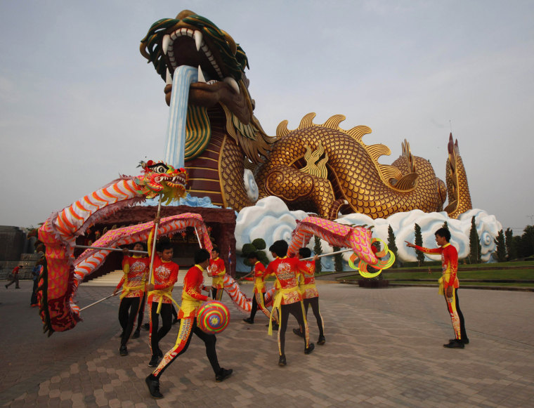 Image: Traditional Chinese Dragon dancers perform ahead of the Chinese Lunar New Year celebrations in Suphan Buri province