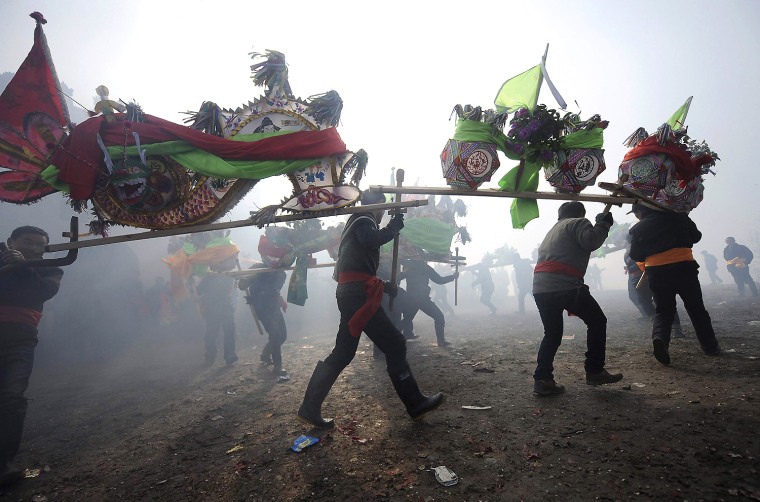 Image: People dance with dragon lanterns on the first day of the Lunar New Year in Wuhu