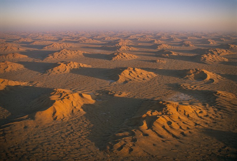 Star dunes in Ramlat Fasad, where Wadi Shihan sinks in to the sands of Omani Empty Quarter.