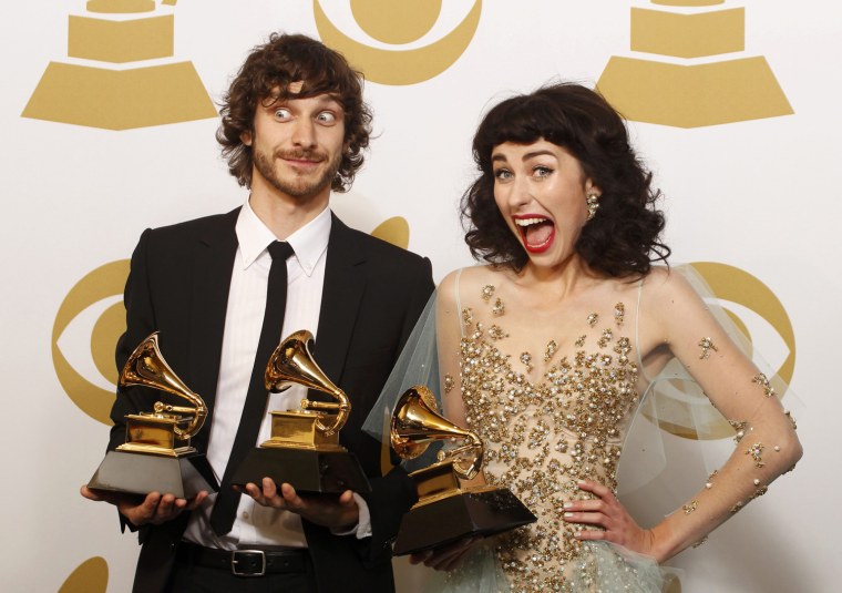 Image: Gotye poses with his Grammy awards with Kimbra backstage at the 55th annual Grammy Awards in Los Angeles