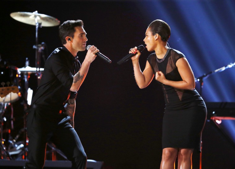 Image: Maroon 5 singer Levine and Keys perform at the 55th annual Grammy Awards in Los Angeles