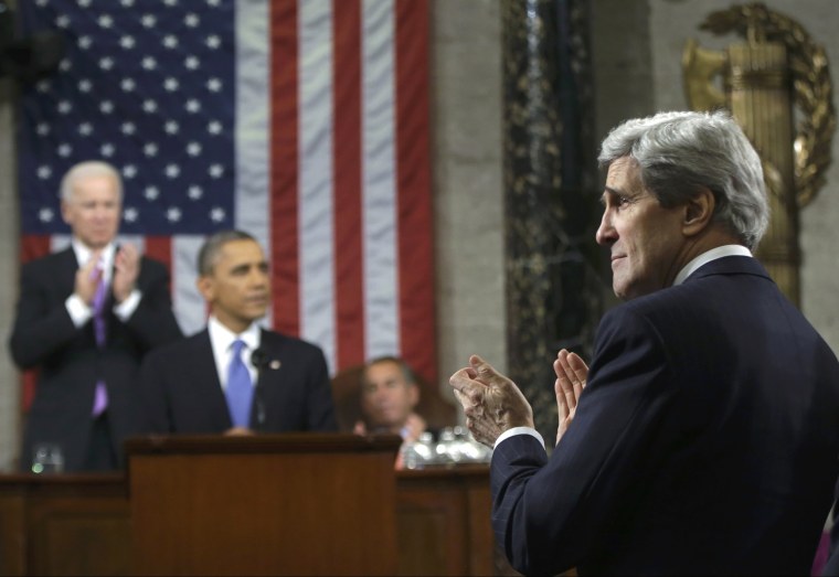 Image: U.S. Secretary of State John Kerry stands to applaud as President Obama delivers his State of the Union speech on Capitol Hill in Washington