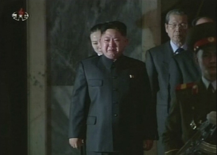 Image: North Korea's new leader Kim Jong-un cries as his father, North Korea's late leader Kim Jong-il, lies in state in this still image taken from video