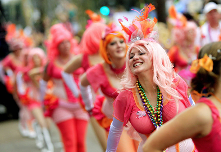 Image: Members of the Pussyfooters Marching Club parade along with the Krewe of Toath along St. Charles Avenue during the weekend before Mardi Gras in New Orleans