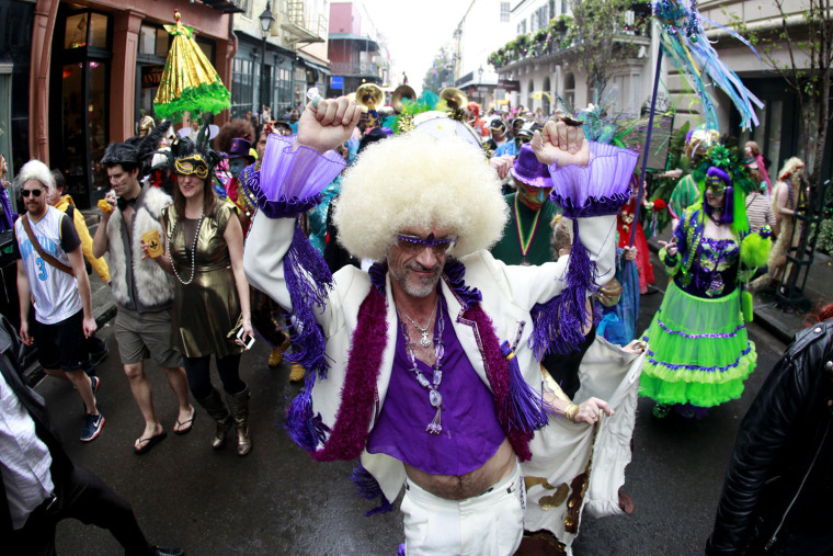 Image: Revelers parade through the French Quarter on Mardi Gras Day in New Orleans