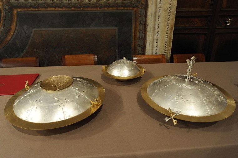 Image: Urns where votes will be placed by Roman Catholic cardinals jn a conclave entrusted with the task of choosing a successor to Pope Benedict are seen at the Sistine Chape at the Vatican